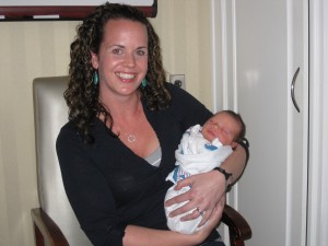 Amber holding Shannon's new baby boy.