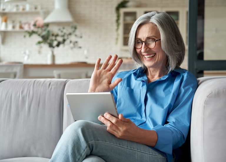 Happy,60s,Older,Mature,Middle,Aged,Adult,Woman,Waving,Hand