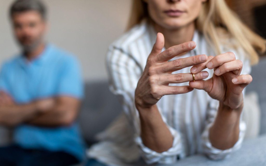 Wife removes her ring after divorce.