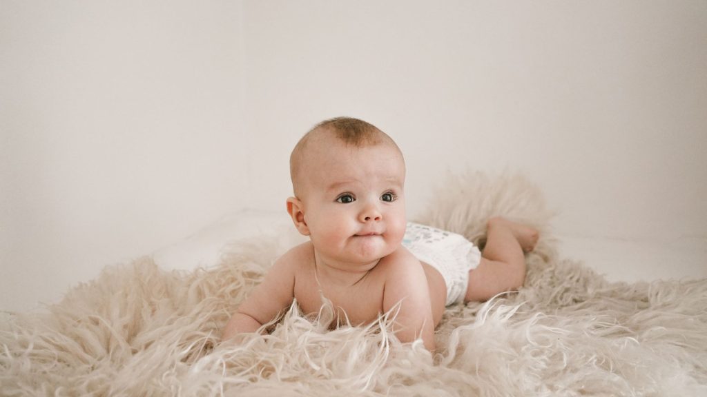 when do babies start rolling over